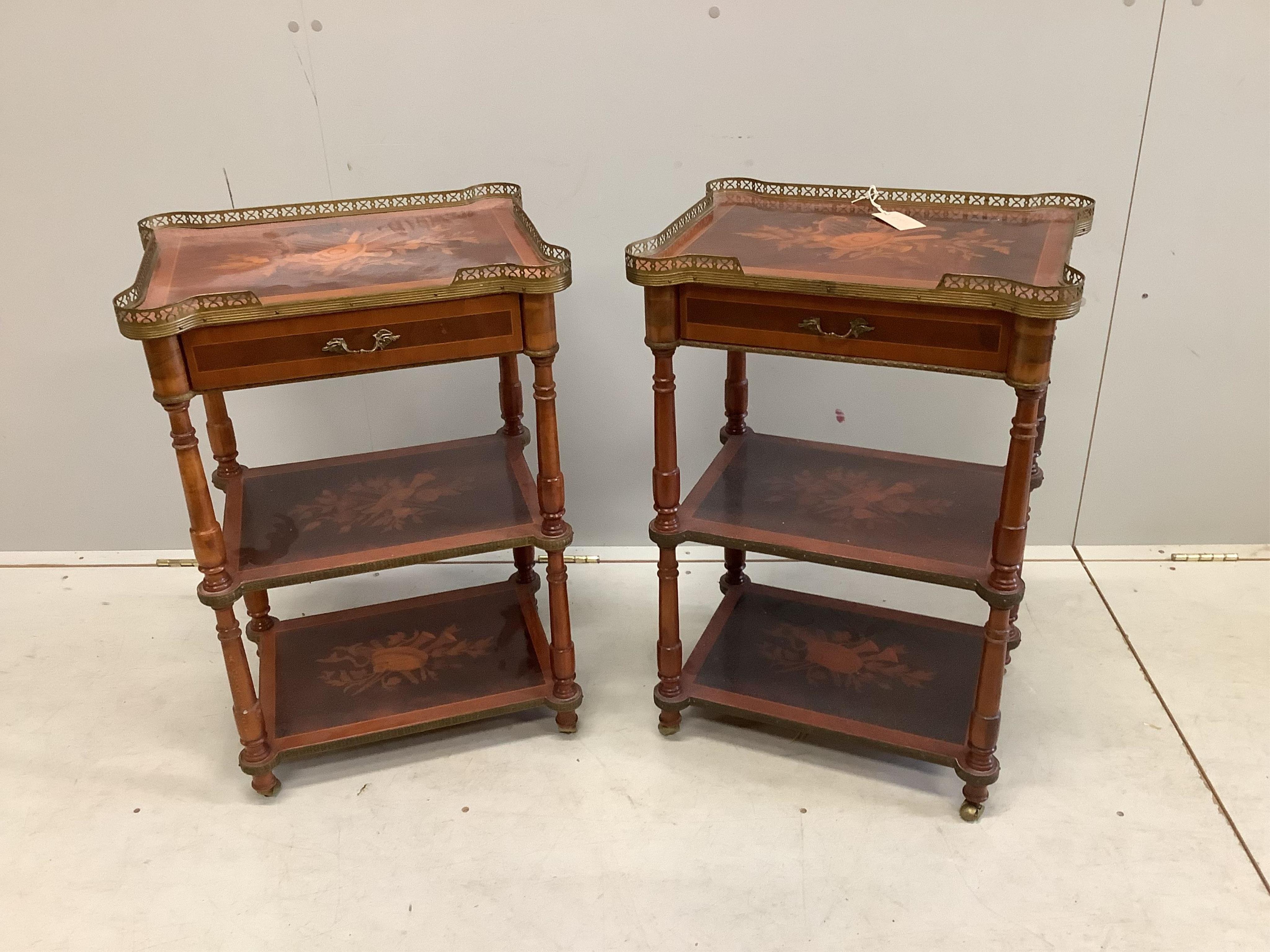 A pair of reproduction marquetry inlaid kingwood three tier tables, width 48cm, depth 37cm, height 71cm. Condition - fair to good